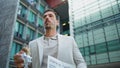 Leader person eating lunch on go architecture place closeup. Latin man hurrying