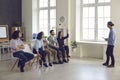 Leader of the startup team listens to the suggestions of his colleagues at a meeting in the office. Royalty Free Stock Photo