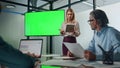 Leader woman presenting mockup project indoors. Lady pointing on greenscreen Royalty Free Stock Photo