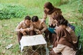 leader of the youth scout group gathered to discuss maps