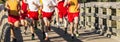 High school boys cross country race going over a bridge Royalty Free Stock Photo