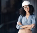 Leadership, architecture and arms crossed with business woman with hard hat working in engineering, designer and
