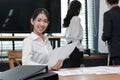 Leadership business woman concept. Confident young Asian businesswoman smiling between listening to presentation in modern office Royalty Free Stock Photo