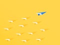 Leadership concept. Blue paper airplane leader standing out from the crowd. Business advantage opportunities and success concept.