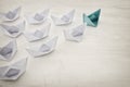 leadership concept, green paper boat leading followers