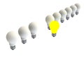 Leadership concept with illuminated light bulb leading among white