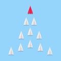 Leadership concept. Lead airplane stand out of other paper plane follower. Paper plane fly over blue background