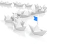 Leadership concept - Leading paper ship with blue flad Royalty Free Stock Photo