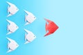 Leadership concept. One red paper fish leading group of white fishes Royalty Free Stock Photo