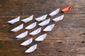 Leadership concept with orange paper ship leading white ship on Royalty Free Stock Photo