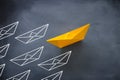 Leadership concept with paper boat on blackboard background. One leader ship leads other ships Royalty Free Stock Photo