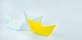 Leadership concept. Paper boats on a blue background. Business concept. Banner. Copy space Royalty Free Stock Photo