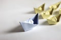 Leadership concept. Paper boats on a white background. Royalty Free Stock Photo