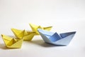 Leadership concept. Paper boats on a white background. Royalty Free Stock Photo