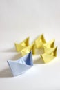 Leadership concept. Paper boats on a white background. Royalty Free Stock Photo