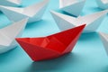 Leadership concept. Red leader paper ship leading among white on blue background Royalty Free Stock Photo