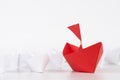 Leadership concept. red paper ship lead among white. Royalty Free Stock Photo