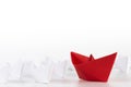 Leadership concept. red paper ship lead among white. Royalty Free Stock Photo