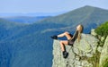 Leadership concept. rock climbing skill. reaching the top. woman relax on mountain cliff. feel freedom. extremely free