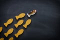 Leadership concept with swimming fish over blackboard background. One leader leads others. Royalty Free Stock Photo