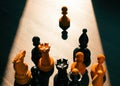 Leadership development concept. A crowd of chess pieces and a pawn in front. Royalty Free Stock Photo