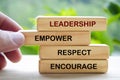 Leadership, empower, respect and encourage text on wooden blocks. Leadership concept Royalty Free Stock Photo
