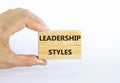 Leadership styles symbol. Wooden blocks with words `Leadership styles` on beautiful white background. Businessman hand. Business Royalty Free Stock Photo