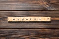 LEADERSHIP word written on wood block. LEADERSHIP text on table, concept