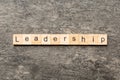 LEADERSHIP word written on wood block. LEADERSHIP text on table, concept