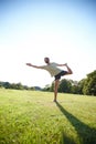 Leading a balanced lifestyle. Full length shot of a handsome mature man doing yoga outdoors. Royalty Free Stock Photo