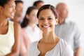 Leading her team to a successful future. Portrait of a young professional with her work colleagues standing behind her. Royalty Free Stock Photo