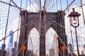 Leading Lines, American flag, street light and orange signs on the Brooklyn Bridge Royalty Free Stock Photo