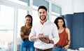 Leading this team into success. Cropped portrait of a handsome young businessman standing in front of his colleagues and Royalty Free Stock Photo