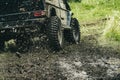 Leading up through the extreme trails. SUV or offroader on mud road. Car racing offroad. Offroad car in action. Dirty Royalty Free Stock Photo