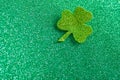 Leaf clover trefoil symbol on a shiny green background. St. Patrick`s Day celebration concept. Horizontal frame Royalty Free Stock Photo