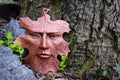 Leaf face sculpture in the garden.