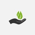 Leaf in hand icon. Vector illustration, flat design Royalty Free Stock Photo