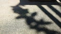 Leaf and Railing Shadows on Textured Concrete Ground Royalty Free Stock Photo