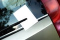 Leaflet behind car wiper Royalty Free Stock Photo