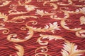 Leafs vines floral patterns prints on a red light orange beige colored floor carpet cloth