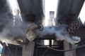 Leakage of steam in heat pipeline. Steam outgoing from the rusty tube with valve