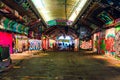 London, UK/Europe; 21/12/2019: Leake Street, underground tunnel with graffiti covered walls in London. Scene with pedestrians and