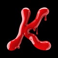 Leaky red alphabet on black background. Handwritten cursive letter K.