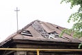 The leaky roof of an old wooden house