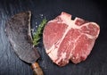 Lean matured raw t-bone steak and vintage cleaver Royalty Free Stock Photo