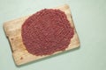 Lean red raw ground meat on old wooden cutting board. Good texture of fresh minced beef. Top view. Copy space