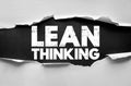 LEAN THINKING text concept on torn paper background showing efficiency improvement, waste reduction, process optimization, and Royalty Free Stock Photo