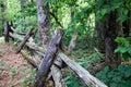 Leaning abandoned split rail fence along a path on the Blue Ridge Parkway Royalty Free Stock Photo