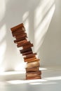 Leaning stack of books on a light background Concept knowledge instability digital art Royalty Free Stock Photo