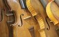 A Leaning Stack of Vintage Antique Violins